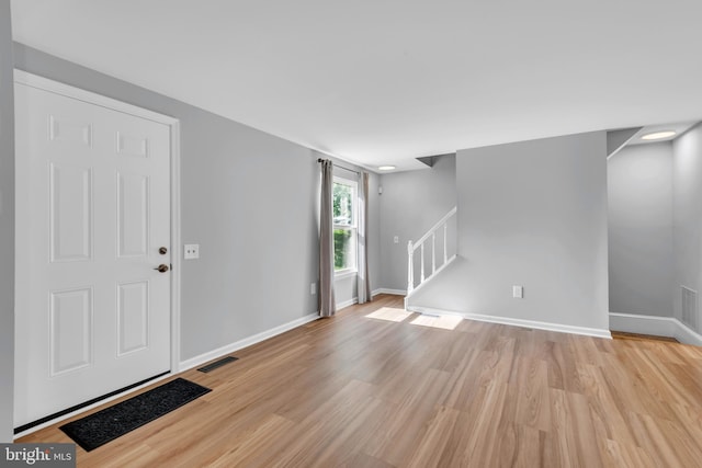 31 Ewing Dr Unit C, Reisterstown, MD 21136 - entryway featuring light wood finished floors and stairs