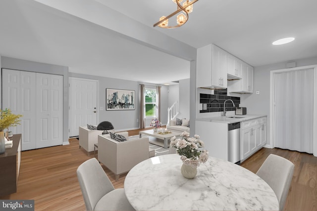 31 Ewing Dr Unit C, Reisterstown, MD 21136 - dining area featuring light wood-style flooring and a chandelier
