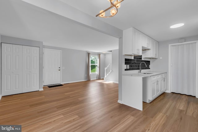 31 Ewing Dr Unit C, Reisterstown, MD 21136 - kitchen with light countertops, light wood-type flooring, and white cabinets
