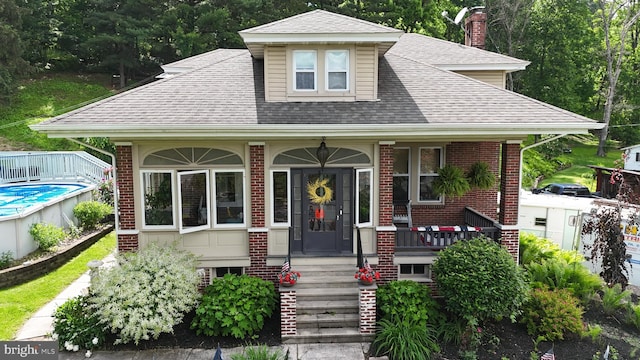 731 W Main St, Leesport, PA 19533 - view of front of property with brick siding, roof with shingles, and a porch