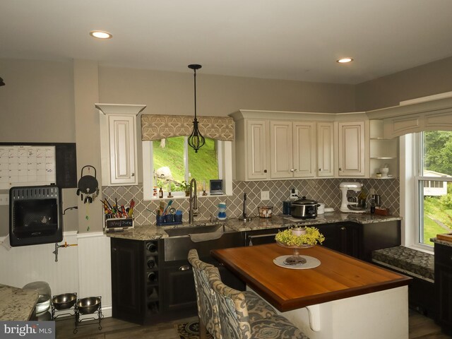 731 W Main St, Leesport, PA 19533 - kitchen featuring dark stone counters, decorative backsplash, dark wood-type flooring, and recessed lighting
