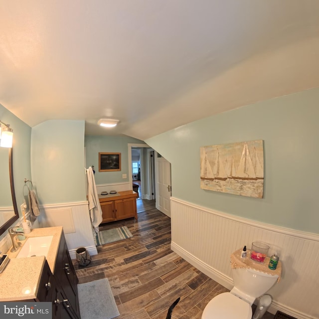 731 W Main St, Leesport, PA 19533 - bathroom featuring wood finished floors, wainscoting, vanity, and lofted ceiling