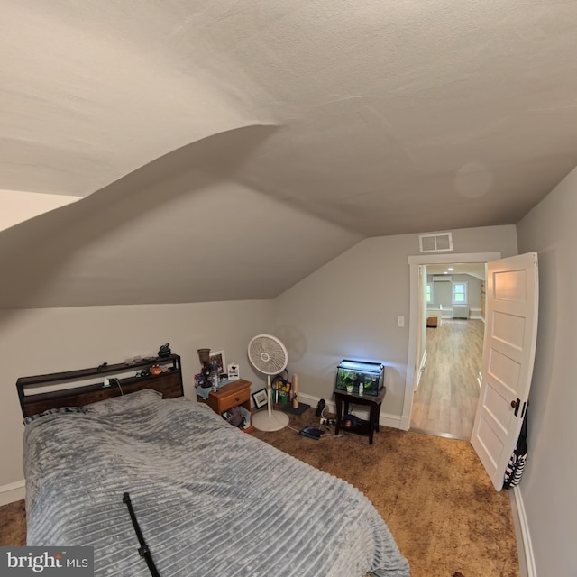 731 W Main St, Leesport, PA 19533 - carpeted bedroom with lofted ceiling and baseboards