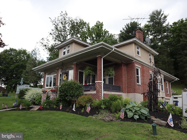 731 W Main St, Leesport, PA 19533 - view of front facade with a front lawn, brick siding, a chimney, and a porch