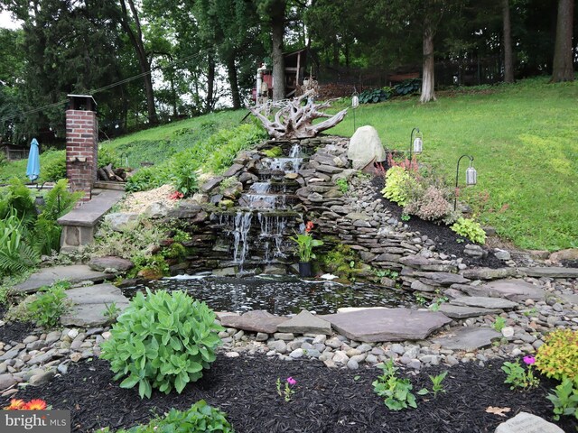 731 W Main St, Leesport, PA 19533 - view of green lawn featuring a garden pond