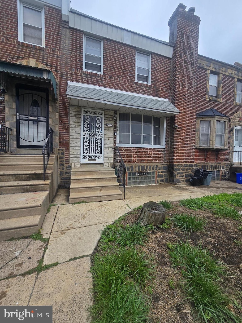 1407 E Hunting Park Ave, Philadelphia, PA 19124 - view of property featuring brick siding