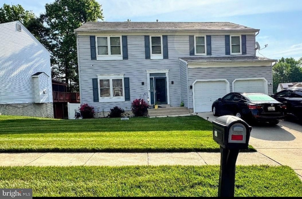 1914 Maemoore Ct, District Heights, MD 20747 - view of front of home featuring concrete driveway, an attached garage, and a front yard