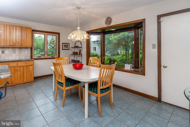 27 Arnold Dr, Princeton Junction, NJ 08550 - dining space featuring a chandelier and light tile patterned floors