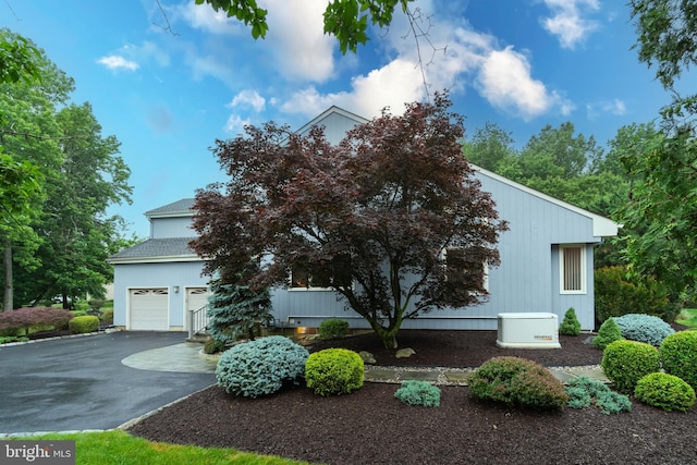 27 Arnold Dr, Princeton Junction, NJ 08550 - view of front of home featuring asphalt driveway and an attached garage