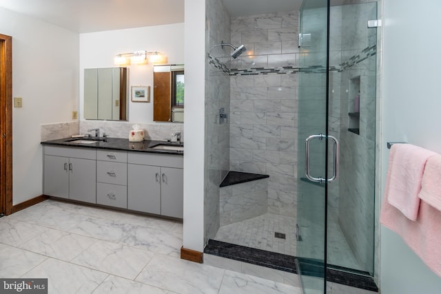 27 Arnold Dr, Princeton Junction, NJ 08550 - full bath with marble finish floors, double vanity, a stall shower, and tasteful backsplash
