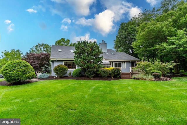 27 Arnold Dr, Princeton Junction, NJ 08550 - back of property with a yard and a chimney