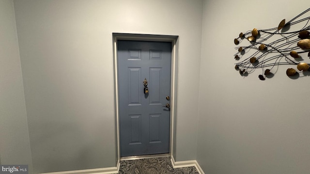 12340 Rosslare Ridge Rd Unit 204, Lutherville Timonium, MD 21093 - doorway to outside featuring baseboards