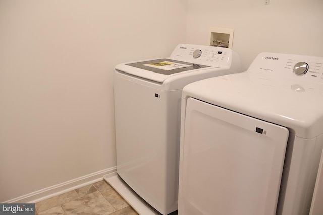 12340 Rosslare Ridge Rd Unit 204, Lutherville Timonium, MD 21093 - laundry area with washing machine and dryer and baseboards
