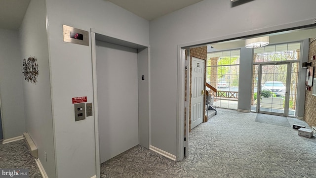 12340 Rosslare Ridge Rd Unit 204, Lutherville Timonium, MD 21093 - hallway featuring carpet, a chandelier, baseboards, and elevator