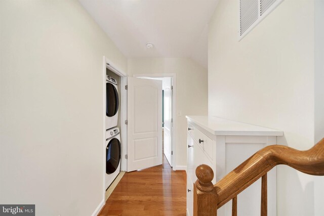 1501 Stack St, Baltimore, MD 21230 - laundry room with estacked washer and dryer and light wood-style flooring