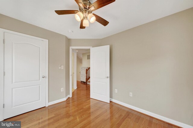 1501 Stack St, Baltimore, MD 21230 - unfurnished bedroom with light wood-style flooring and ceiling fan