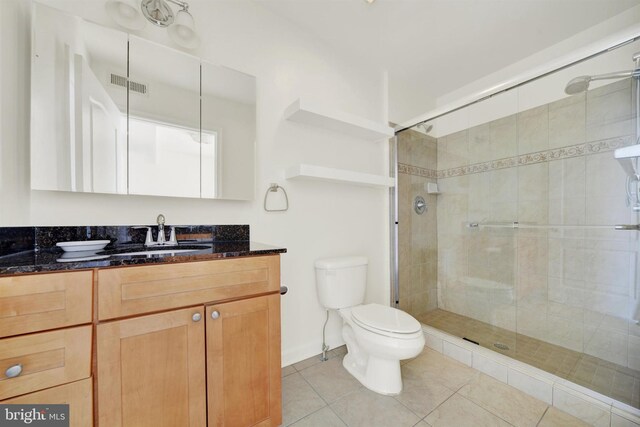 1501 Stack St, Baltimore, MD 21230 - full bathroom featuring vanity, a shower stall, and tile patterned flooring