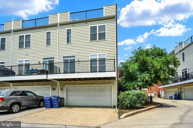 1501 Stack St, Baltimore, MD 21230 - view of front of property featuring a chimney, driveway, and an attached garage