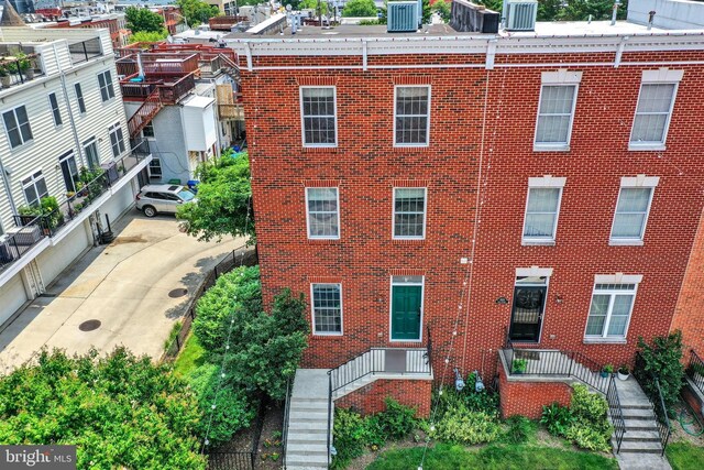 1501 Stack St, Baltimore, MD 21230 - view of front of home with brick siding and stairway