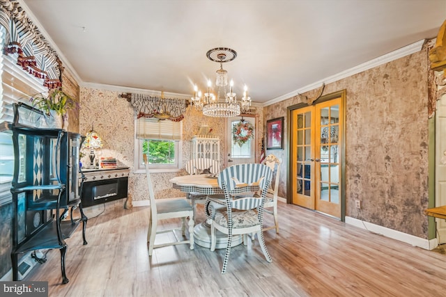 947 Martin Rd, Baltimore, MD 21221 - dining area with french doors, wallpapered walls, ornamental molding, a chandelier, and wood finished floors