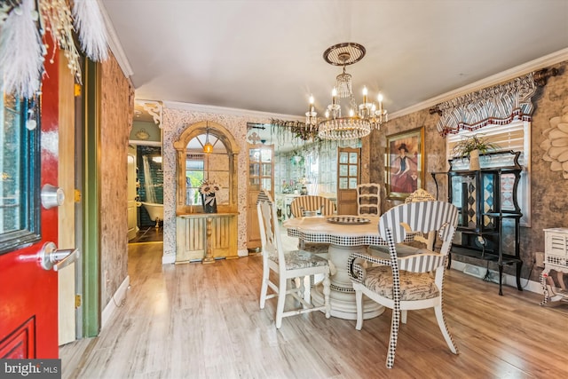 947 Martin Rd, Baltimore, MD 21221 - dining room with a chandelier, wood finished floors, ornamental molding, and wallpapered walls