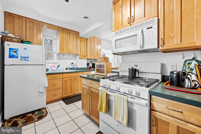 2707 Kildaire Dr, Baltimore, MD 21234 - kitchen with white appliances, light tile patterned floors, and dark countertops