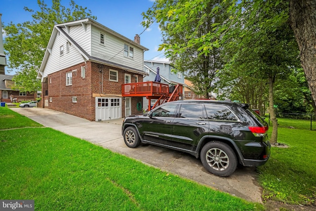 2707 Kildaire Dr, Baltimore, MD 21234 - view of side of home with brick siding, an attached garage, a chimney, concrete driveway, and a wooden deck