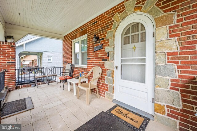 2707 Kildaire Dr, Baltimore, MD 21234 - property entrance with covered porch and brick siding