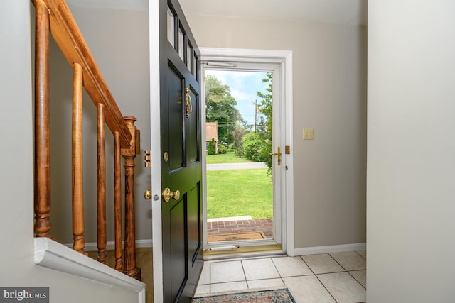 12 Hatsawap Rd, Cambridge, MD 21613 - entrance foyer with stairs, light tile patterned floors, and baseboards