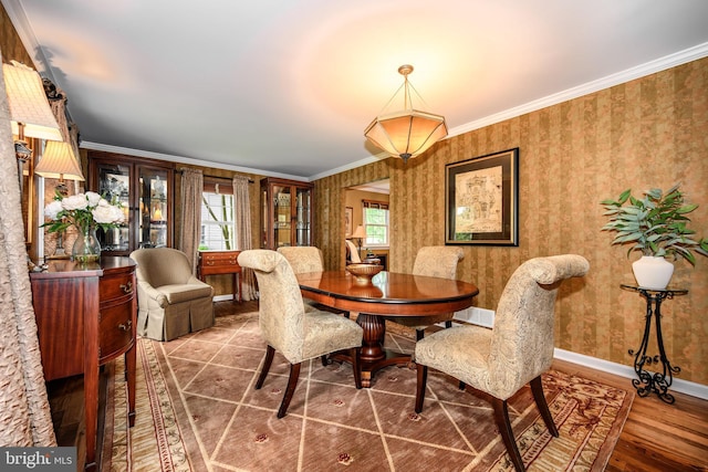 12 Hatsawap Rd, Cambridge, MD 21613 - dining room with wallpapered walls, ornamental molding, and baseboards