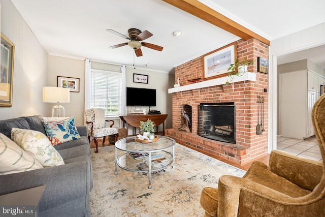12 Hatsawap Rd, Cambridge, MD 21613 - tiled living area featuring ornamental molding, ceiling fan, and a fireplace