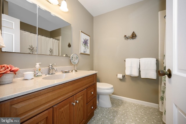 12 Hatsawap Rd, Cambridge, MD 21613 - bathroom featuring vanity, baseboards, toilet, and tile patterned floors