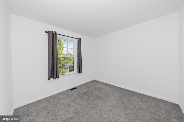 605 Red Timber Ln, Smyrna, DE 19977 - unfurnished room with dark colored carpet and baseboards