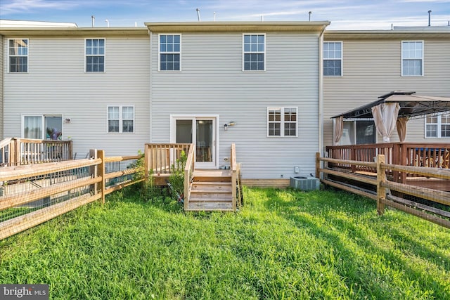 605 Red Timber Ln, Smyrna, DE 19977 - back of property featuring a gazebo and a wooden deck