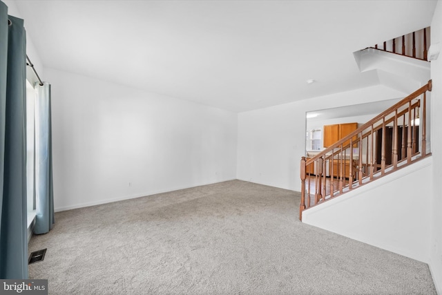 605 Red Timber Ln, Smyrna, DE 19977 - unfurnished living room with carpet and stairway