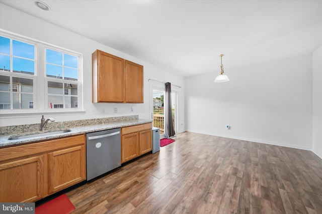 605 Red Timber Ln, Smyrna, DE 19977 - kitchen featuring stainless steel dishwasher, wood finished floors, hanging light fixtures, and light stone countertops