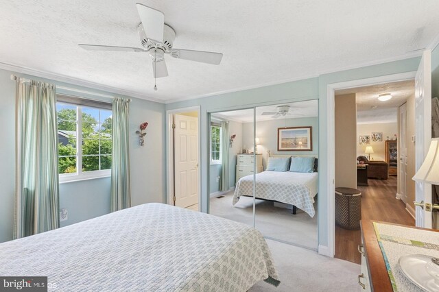 12706 Northcliff Rd, Bowie, MD 20720 - bedroom featuring a closet, crown molding, a ceiling fan, and a textured ceiling