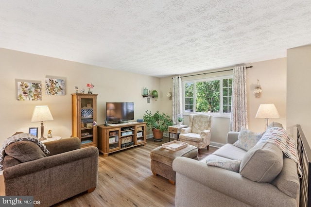 12706 Northcliff Rd, Bowie, MD 20720 - living area featuring a textured ceiling and wood finished floors