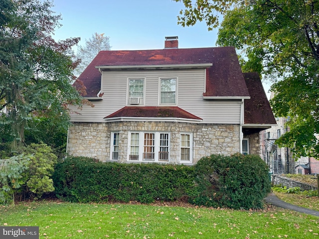 348 E Foster Ave, State College, PA 16801 - view of front of property featuring stone siding, a front lawn, and a chimney