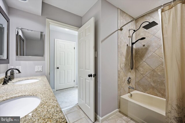 19112 Gunnerfield Ln, Germantown, MD 20874 - full bath featuring shower / bath combo with shower curtain, double vanity, tile patterned floors, and baseboards