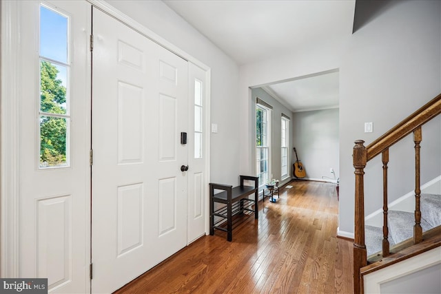 19112 Gunnerfield Ln, Germantown, MD 20874 - foyer entrance with hardwood / wood-style flooring, stairway, and baseboards