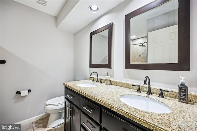 19112 Gunnerfield Ln, Germantown, MD 20874 - bathroom with toilet, double vanity, a tile shower, baseboards, and tile patterned floors