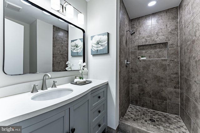 7910 Peyton Forest Trl, Annandale, VA 22003 - bathroom with vanity, a tile shower, and recessed lighting