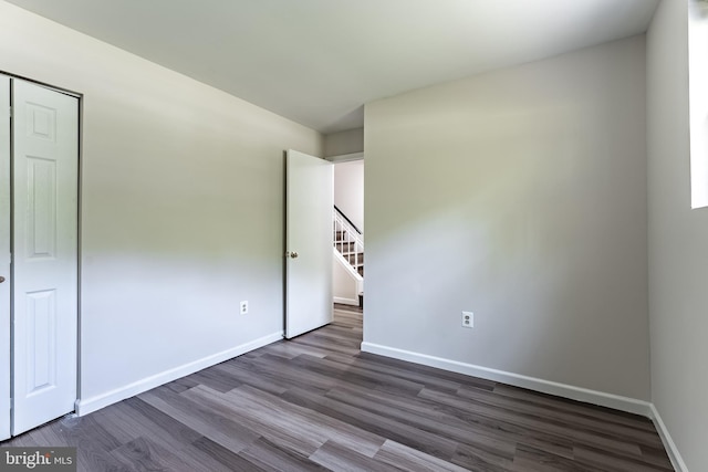 7910 Peyton Forest Trl, Annandale, VA 22003 - unfurnished room featuring dark wood-style floors and stairs