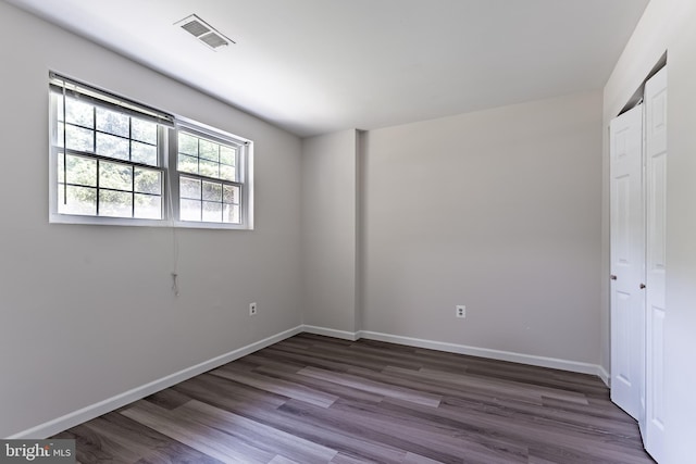 7910 Peyton Forest Trl, Annandale, VA 22003 - unfurnished bedroom with dark wood finished floors and a closet