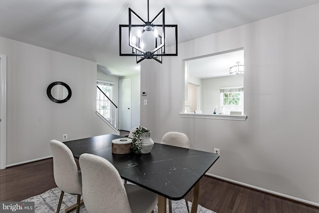 7910 Peyton Forest Trl, Annandale, VA 22003 - dining area with wood finished floors, a chandelier, and stairs
