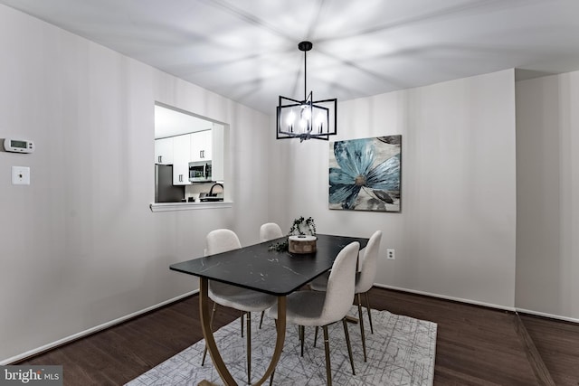 7910 Peyton Forest Trl, Annandale, VA 22003 - dining space featuring a chandelier and dark wood-style flooring