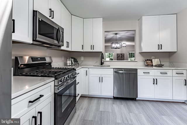 7910 Peyton Forest Trl, Annandale, VA 22003 - kitchen with appliances with stainless steel finishes, light countertops, and white cabinets