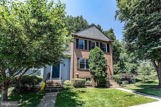 7910 Peyton Forest Trl, Annandale, VA 22003 - view of front facade featuring brick siding and a front lawn
