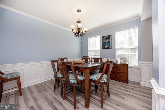 2200 Summerdale Ln, Linfield, PA 19468 - dining space featuring light wood finished floors, a chandelier, a wainscoted wall, ornamental molding, and a decorative wall